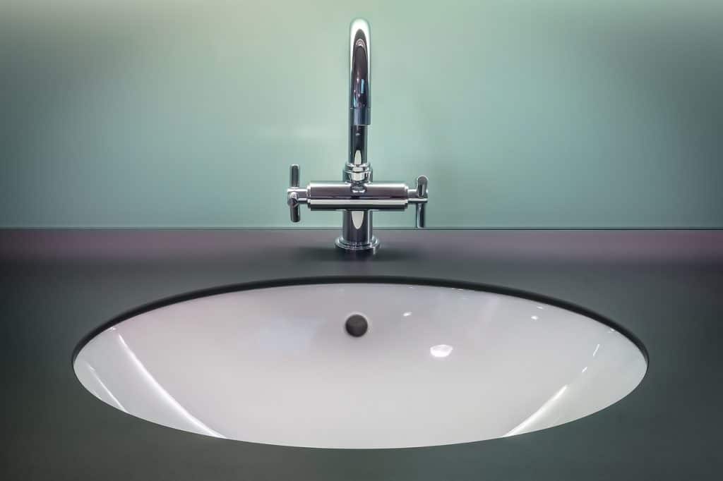 bathroom limescale close up faucet