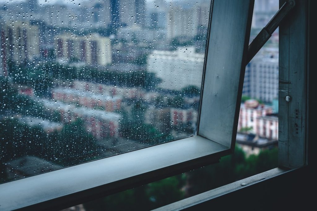 condensation absorbing tape installed along bottom edge of apartment window frame, preventing water damage