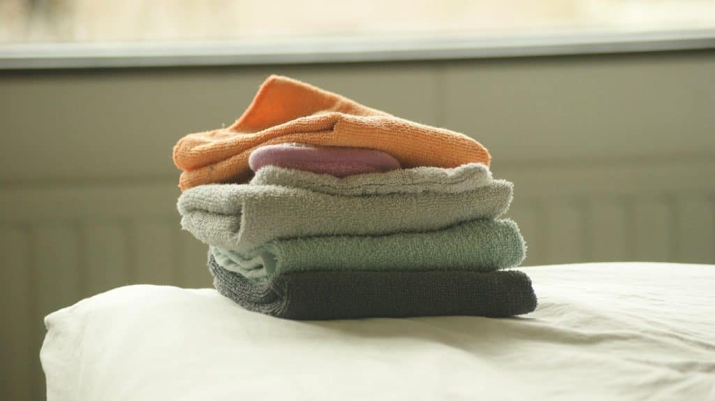 clean white towels folded neatly after drying