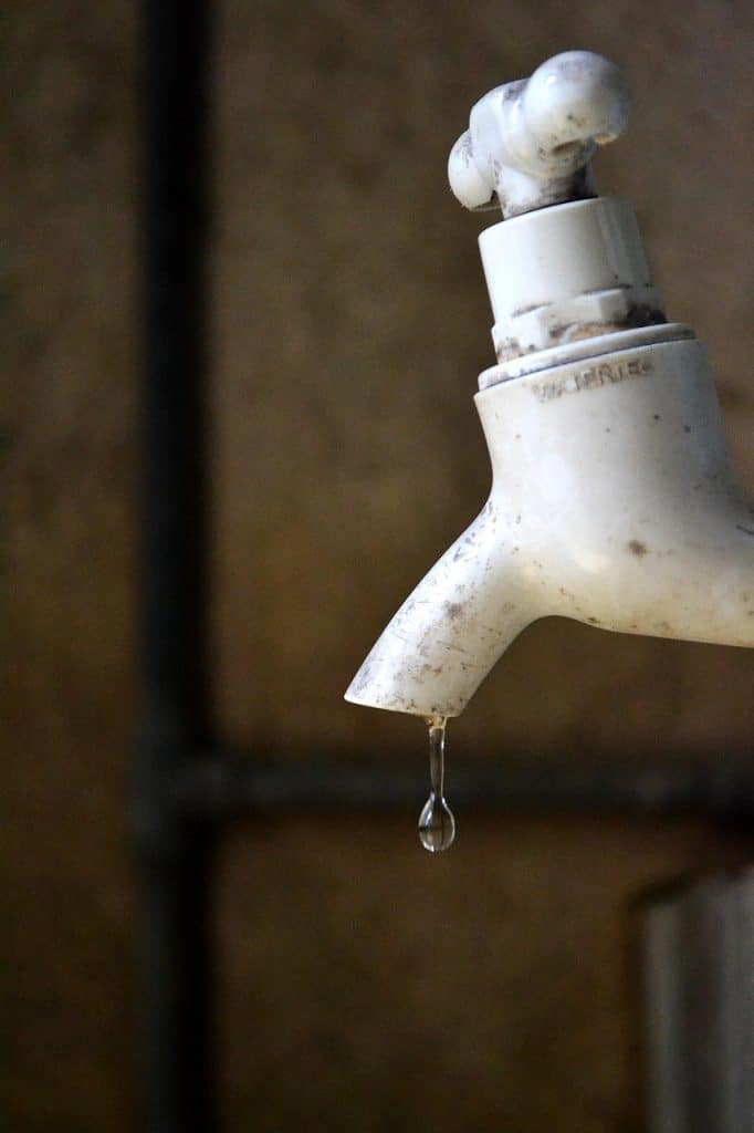 dripping faucet close-up water drops