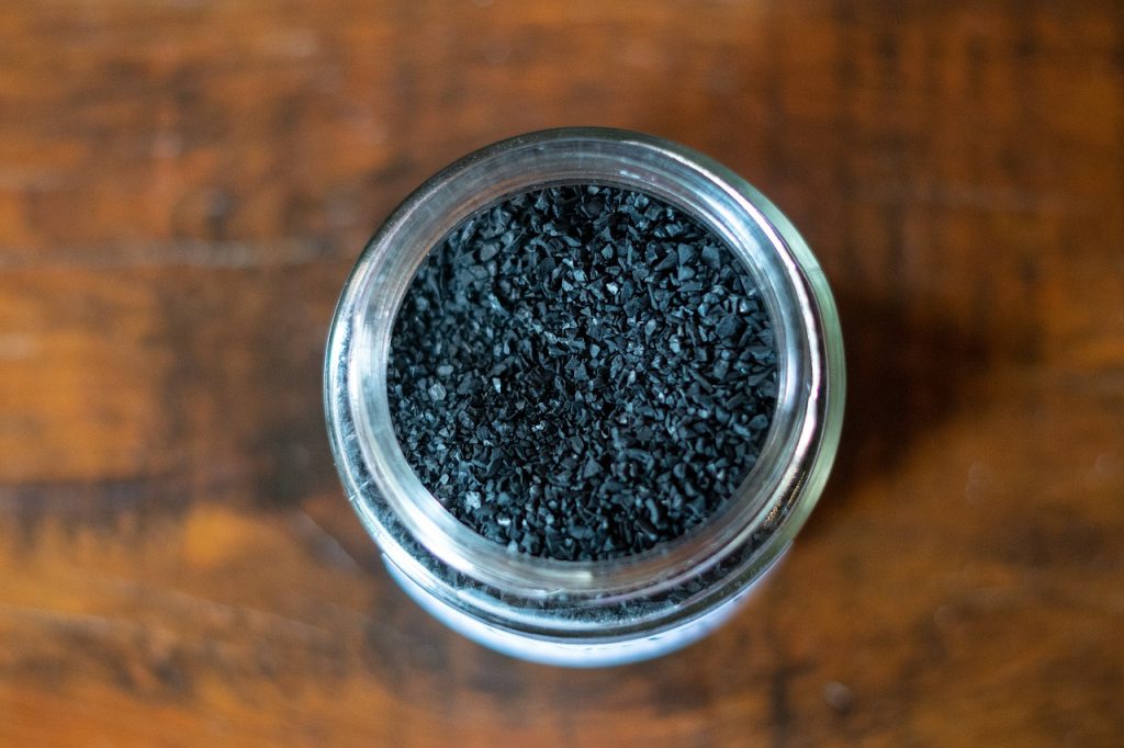 activated charcoal and baking soda placed inside refrigerator shelf