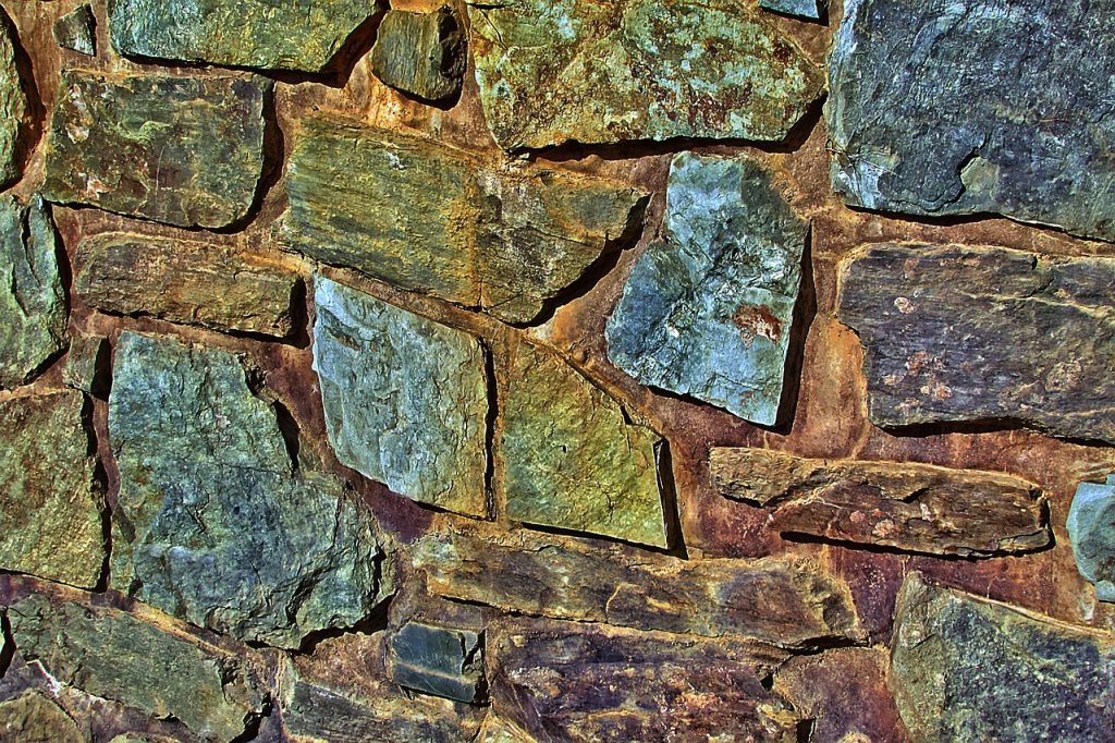 different types of wallpaper materials including vinyl and fabric on a wall