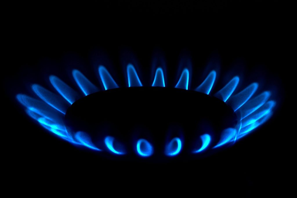 gas stove burner grease buildup close up