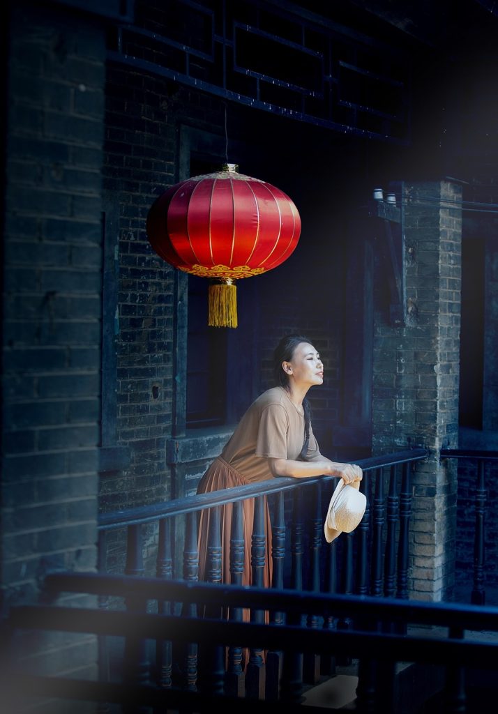 mattress standing upright on a sunny balcony for drying