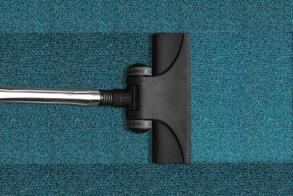 cleaning supplies for mold removal laid on floor