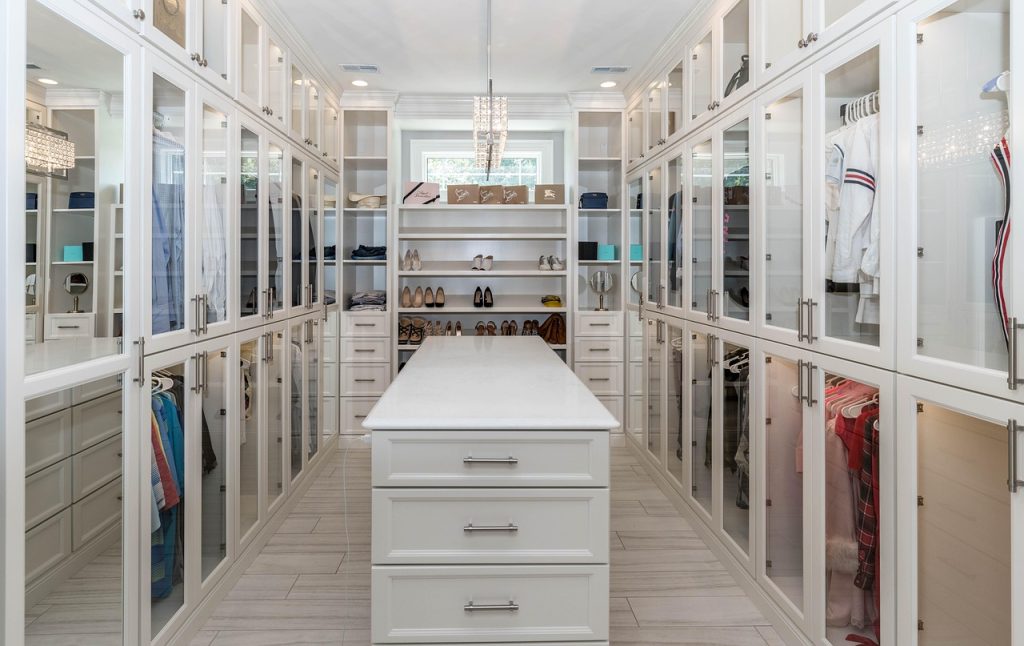 dehumidifier packs placed inside wooden closet with clothes