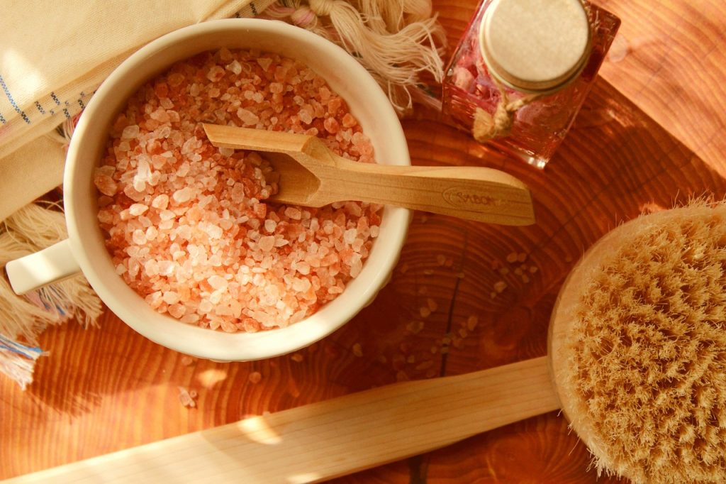 coarse salt scrubbing inside cast iron pot