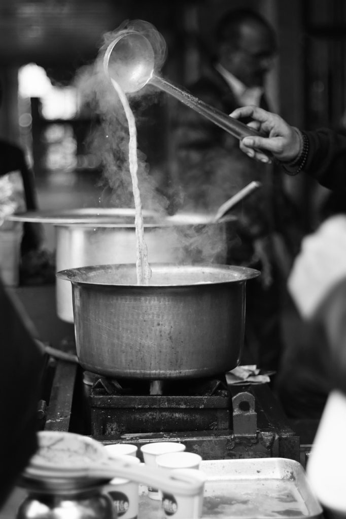 pouring lukewarm water into freshly burnt pot immediately