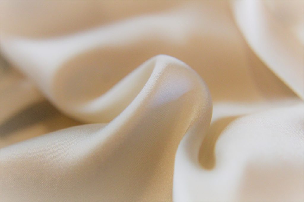 delicate silk blouse fabric with gentle stain removal using cotton swab