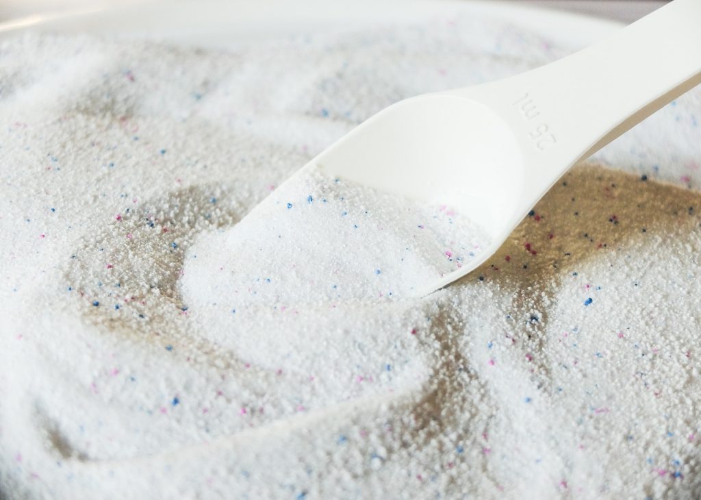 liquid detergent poured into washing machine drawer