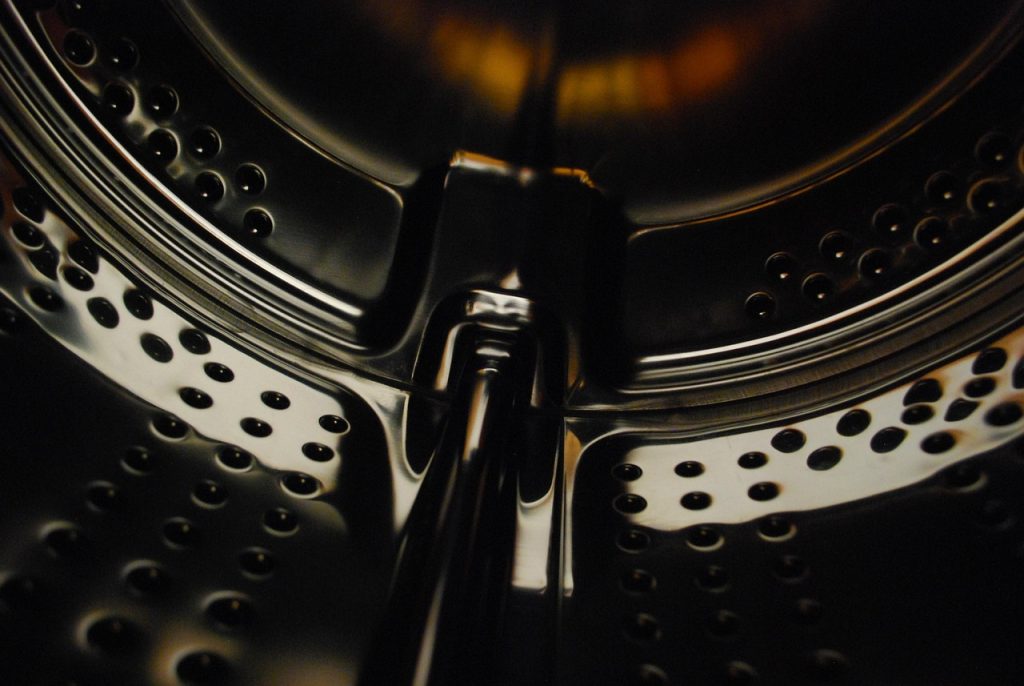 washing machine drum with duvet inside water