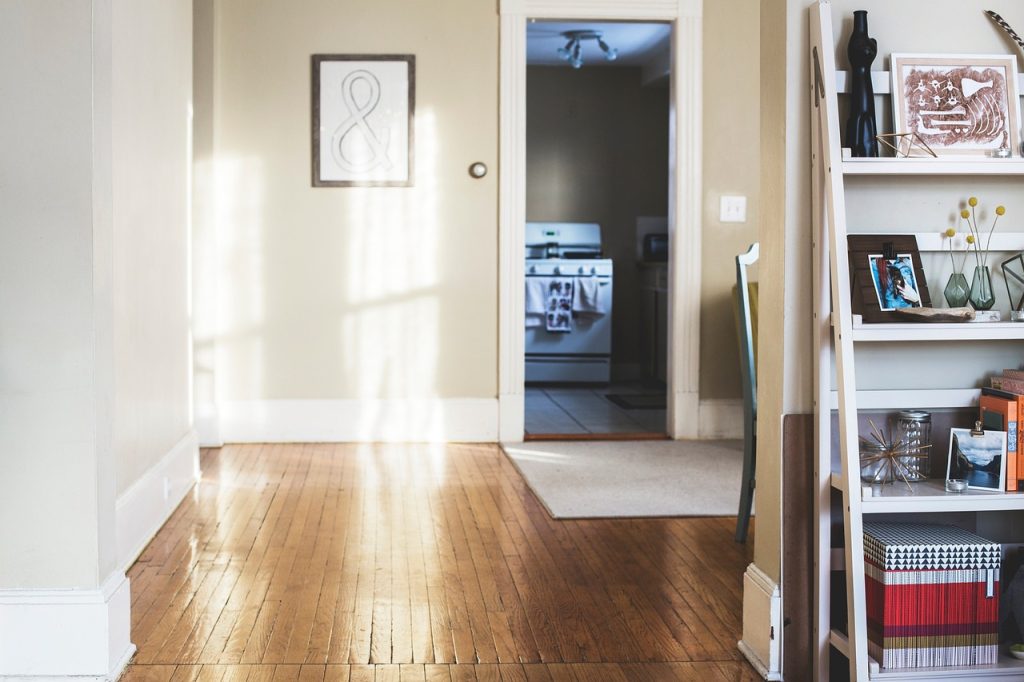 old wooden floor with visible scratches in a cozy korean apartment