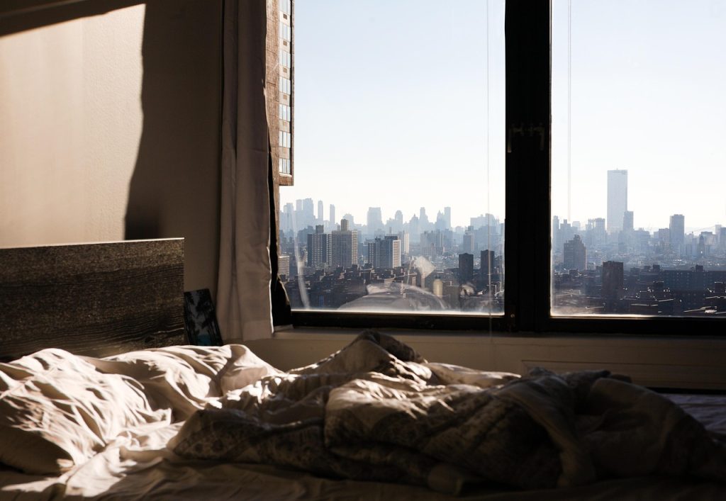 small korean apartment interior with moving boxes, morning sunlight through window