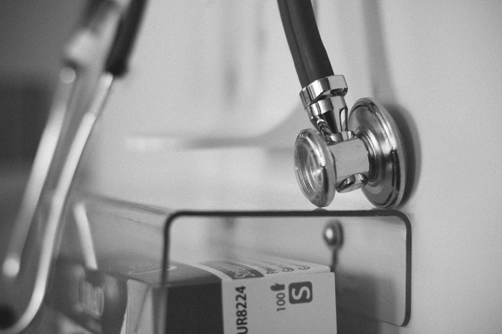 pregnant woman at hospital check-up with doctor
