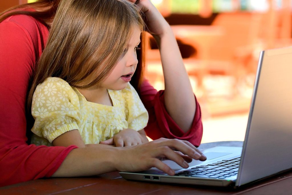 person applying for government support on laptop at home