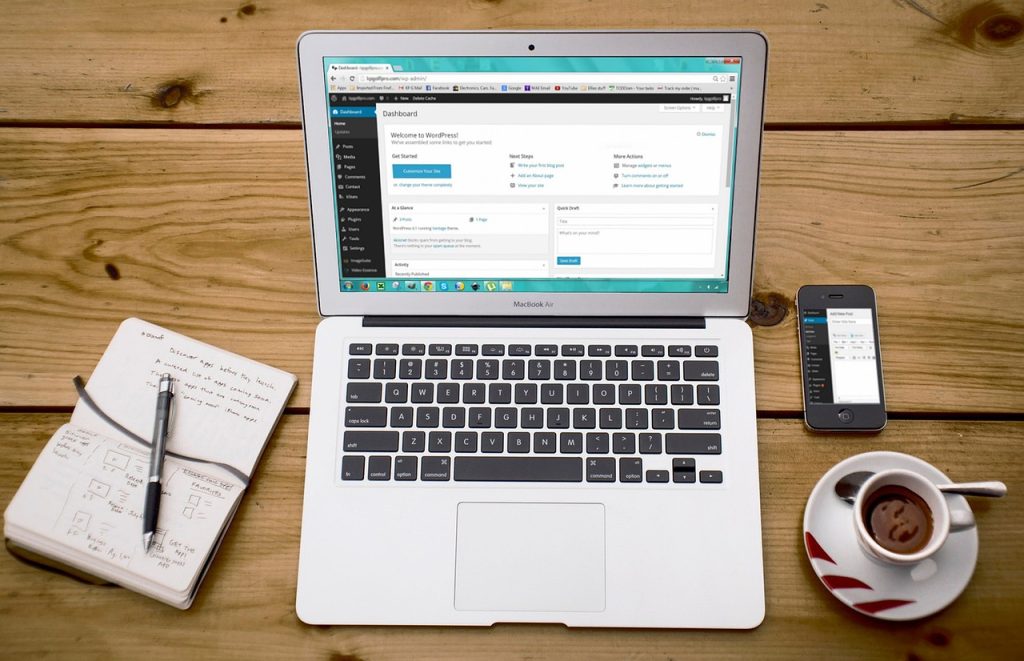 man logging into Korean government employment insurance website on laptop