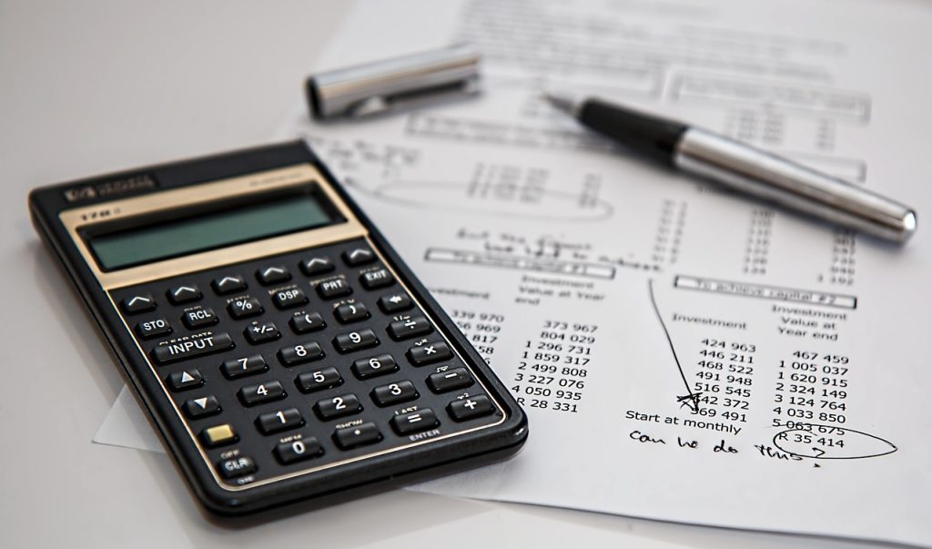 checklist notepad with health insurance documents