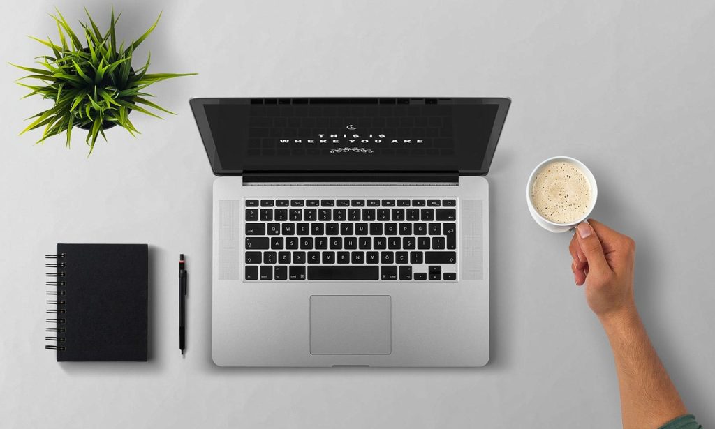 person submitting online insurance application form on computer
