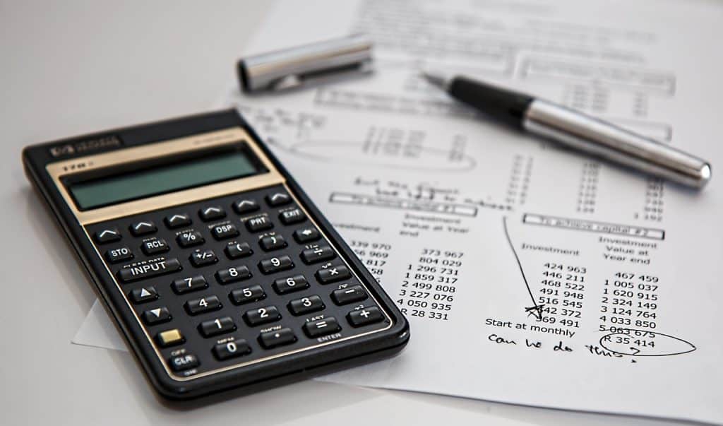health insurance premium document with calculator on desk