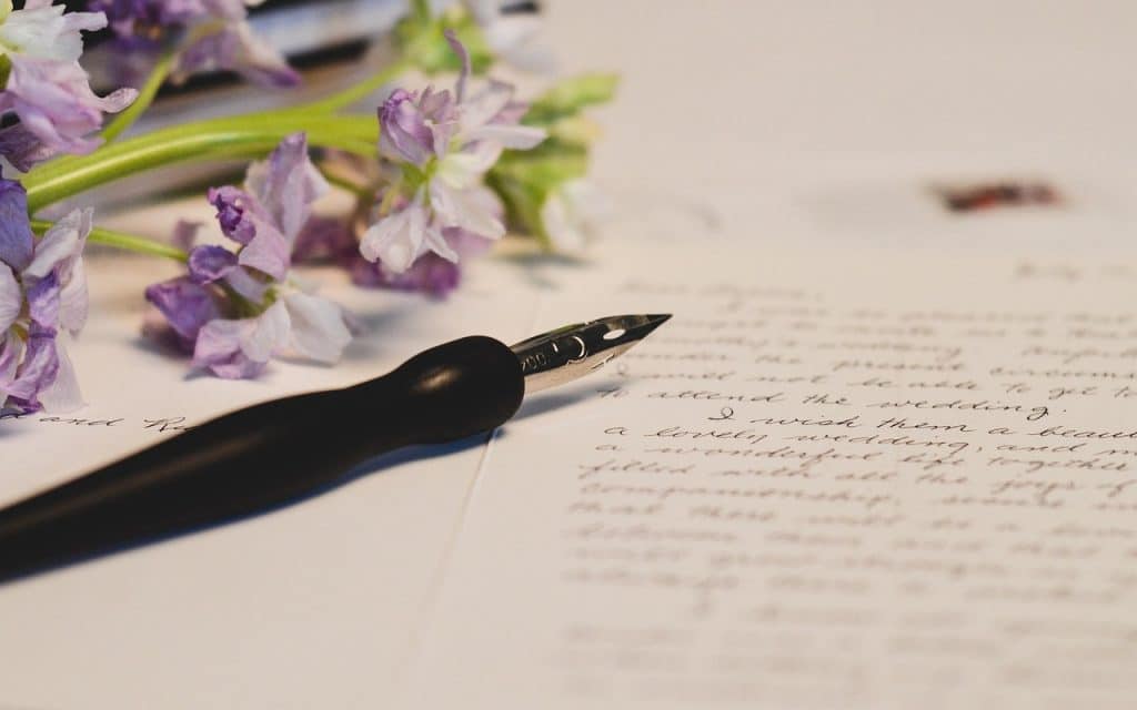 checklist on paper with pen and magnifying glass on desk