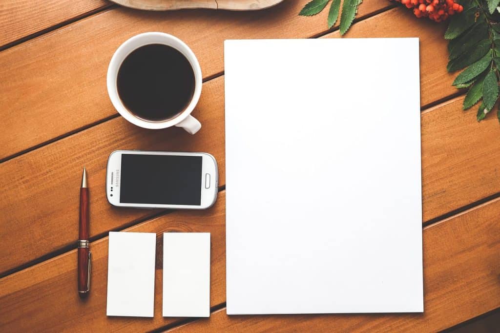 checklist on clipboard with pen on a wooden table
