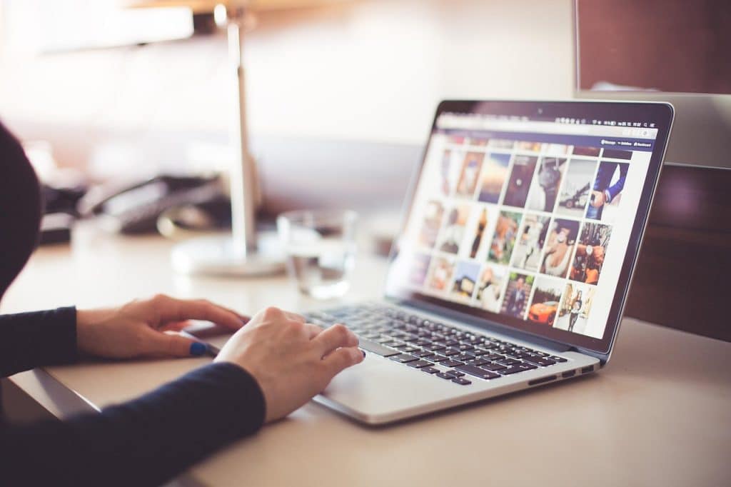 young person browsing government job support website on laptop at home