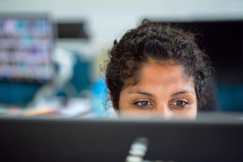 Korean employee working reduced hours at office desk