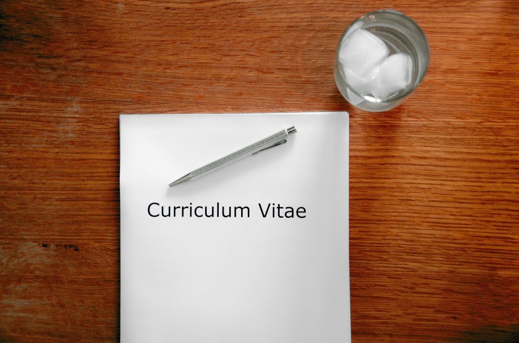 government welfare application form on desk with pen