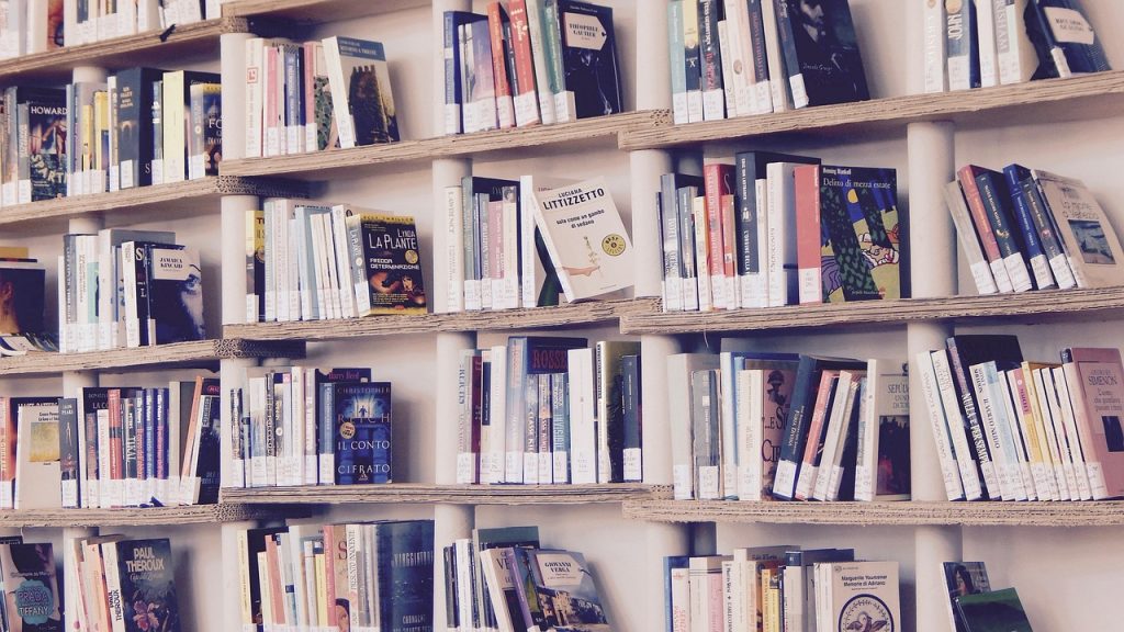 bookstore interior with warm lighting and people browsing shelves