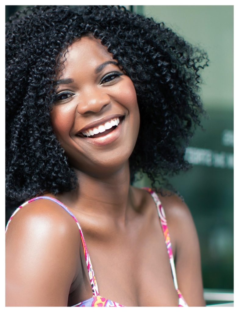 young person looking relieved after submitting application at counter