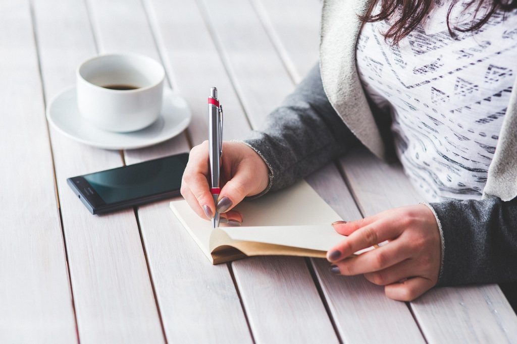 young woman reviewing housing benefit documents at a desk