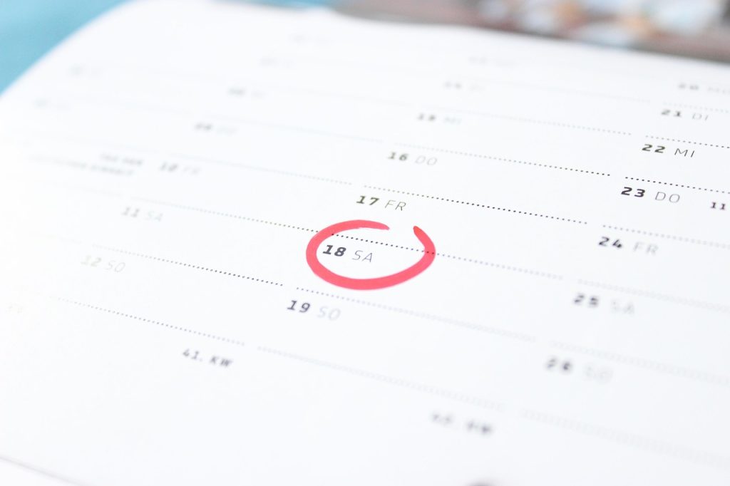 calendar marked with car inspection deadline and insurance renewal date